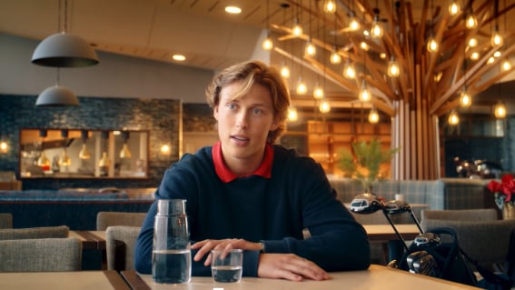 guy sat at a table in restaurant