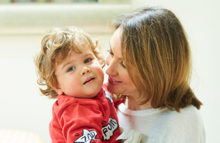 A portrait photo of a child affected by a congenital heart problem.