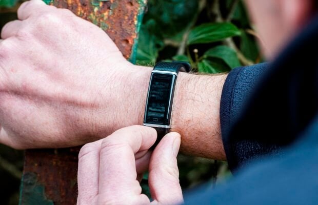 Stephen looking at his digital watch