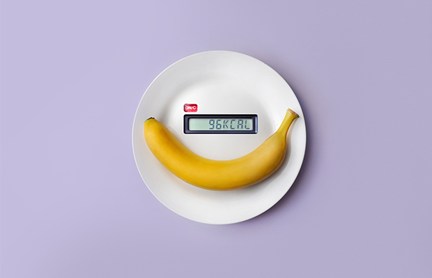 A banana on a weighing scale with 96kcal on the display