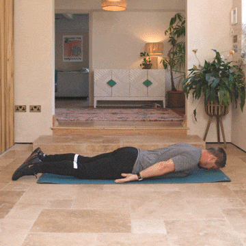 Andrew Scard demonstrates the knee to chest stretch.