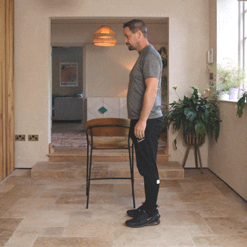 Andrew Scard demonstrates a hamstring stretch.