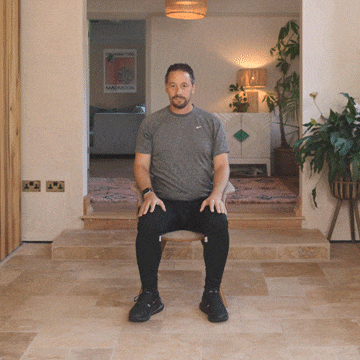 Andrew Scard demonstrates the shoulder stretch.