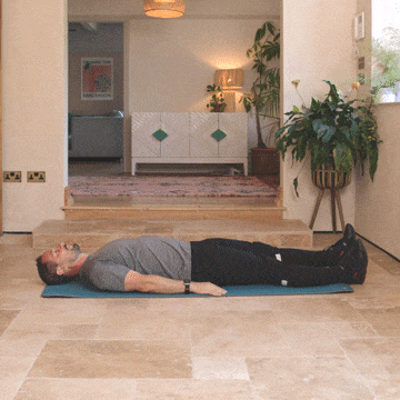 Andrew Scard demonstrates the knee to chest stretch.