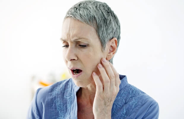 Woman with jaw pain