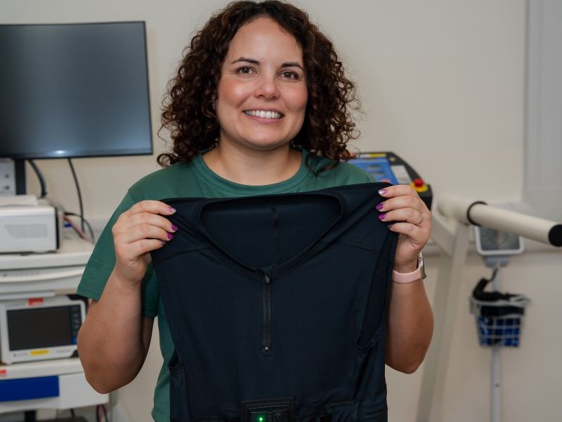 Carly holding T-shirt